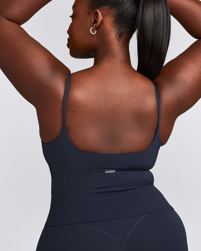 SoftMotion™ Strappy Mid Tank Top with Built in Bra Shelf with Gray Logo | True Blue