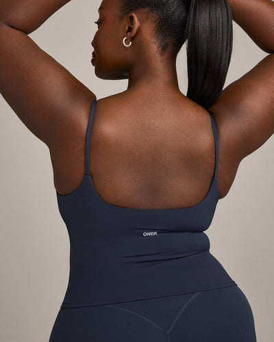SoftMotion™ Strappy Mid Tank Top with Built in Bra Shelf with Gray Logo | True Blue