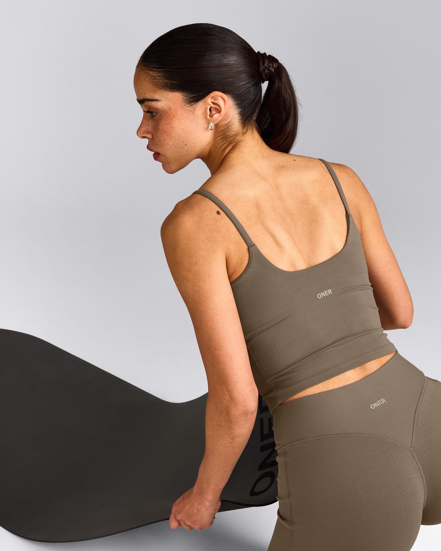SoftMotion™ Strappy Mid Tank Top with Built in Bra Shelf with Gray Logo | Moss Brown