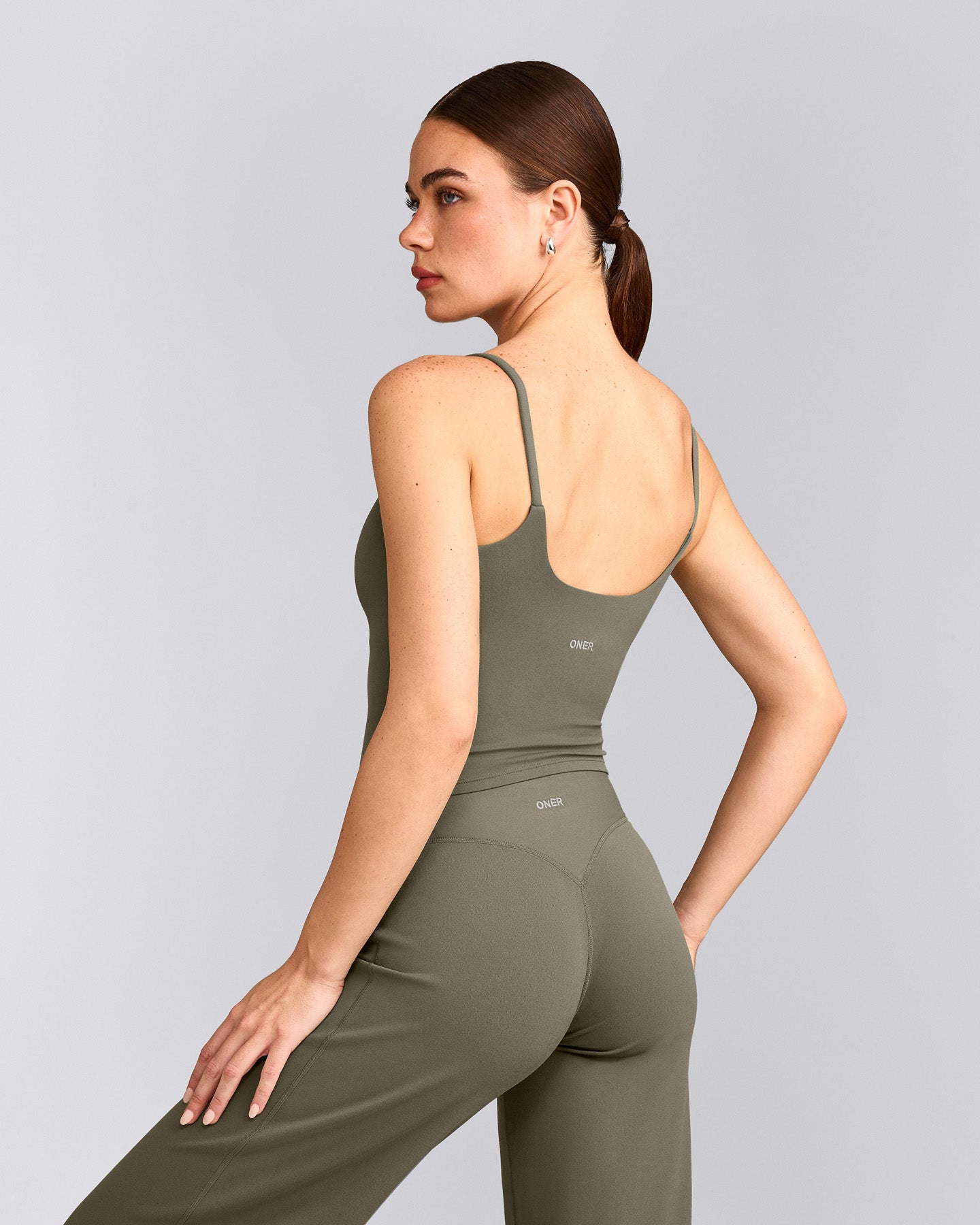 SoftMotion™ Strappy Mid Tank Top with Built in Bra Shelf with Gray Logo | Alpine Green