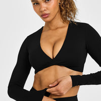 Unified Twist Front Long Sleeve Crop Top White Logo | Black