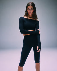 SoftMotion™ High Waisted Capri Leggings with Gray Logo | Black