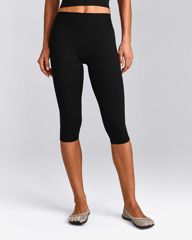 SoftMotion™ High Waisted Capri Leggings with Gray Logo | Black