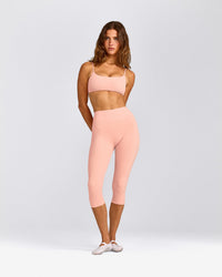 SoftMotion™ High Waisted Capri Leggings with Gray Logo | Peach Orange