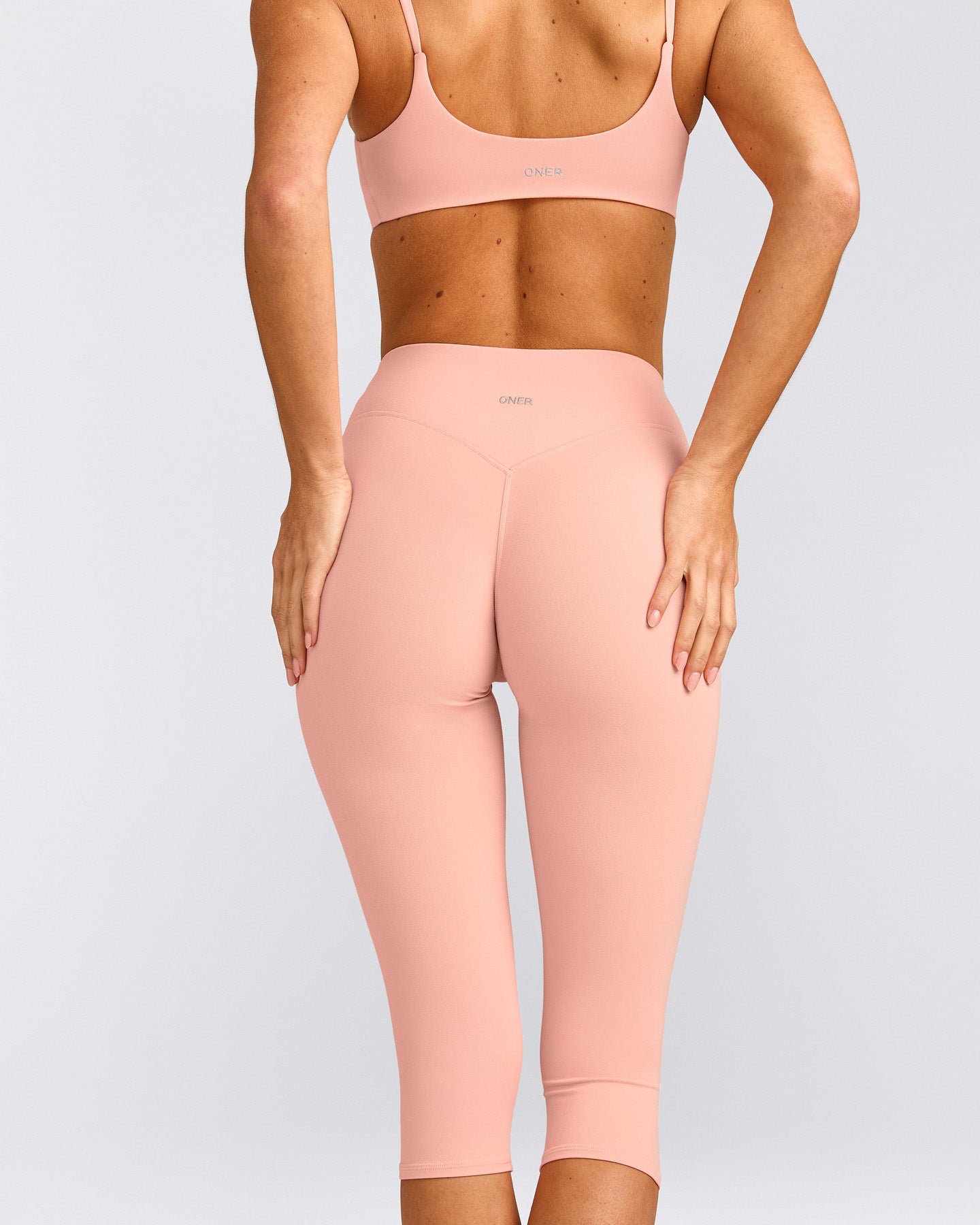 SoftMotion™ High Waisted Capri Leggings with Gray Logo | Peach Orange
