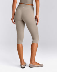 SoftMotion™ High Waisted Capri Leggings with White Logo | Warm Sand