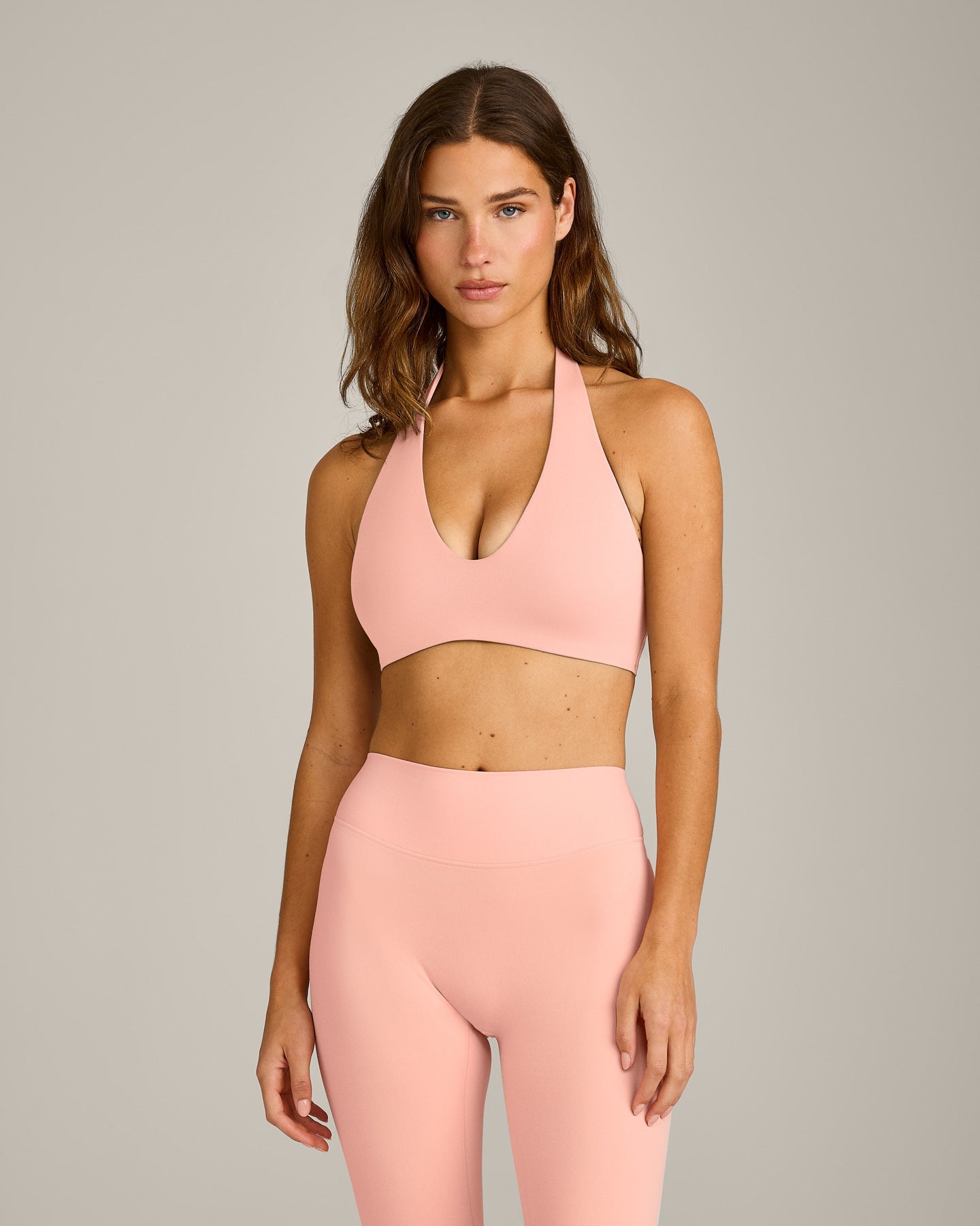 SoftMotion™ Minimal Halter Neck Bralette with Gray Logo | Peach Orange