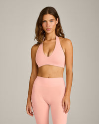 SoftMotion™ Minimal Halter Neck Bralette with Gray Logo | Peach Orange
