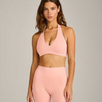 SoftMotion™ Minimal Halter Neck Bralette with Gray Logo | Peach Orange