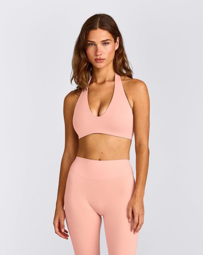 SoftMotion™ Minimal Halter Neck Bralette with Gray Logo | Peach Orange