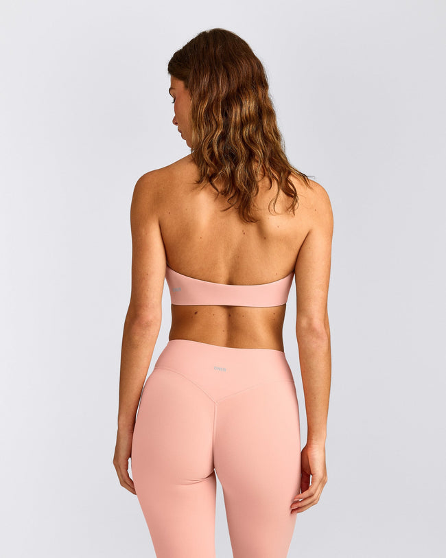 SoftMotion™ Minimal Halter Neck Bralette with Gray Logo | Peach Orange