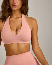 SoftMotion™ Minimal Halter Neck Bralette with Gray Logo | Peach Orange