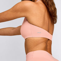 SoftMotion™ Minimal Halter Neck Bralette with Gray Logo | Peach Orange