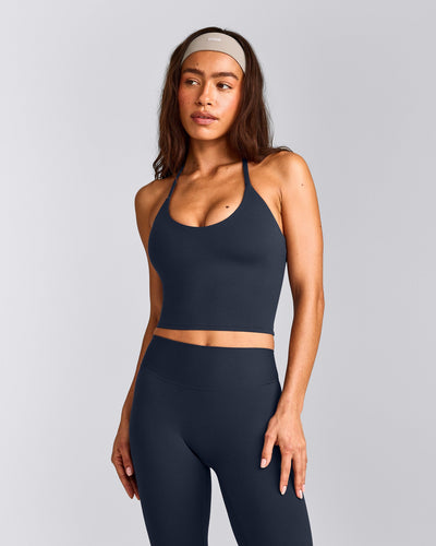 SoftMotion™ Strappy Halter Neck Mid Tank Top with Built in Bra Shelf with Gray Logo | True Blue