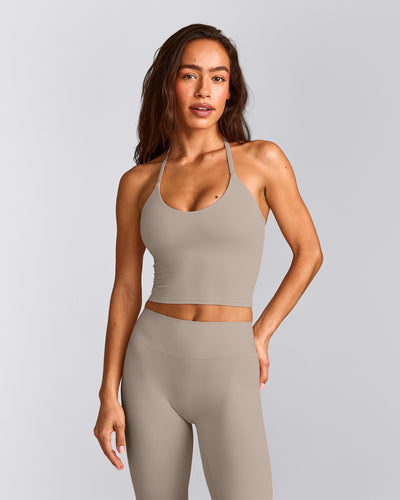 SoftMotion™ Strappy Halter Neck Mid Tank Top with Built in Bra Shelf with White Logo | Warm Sand