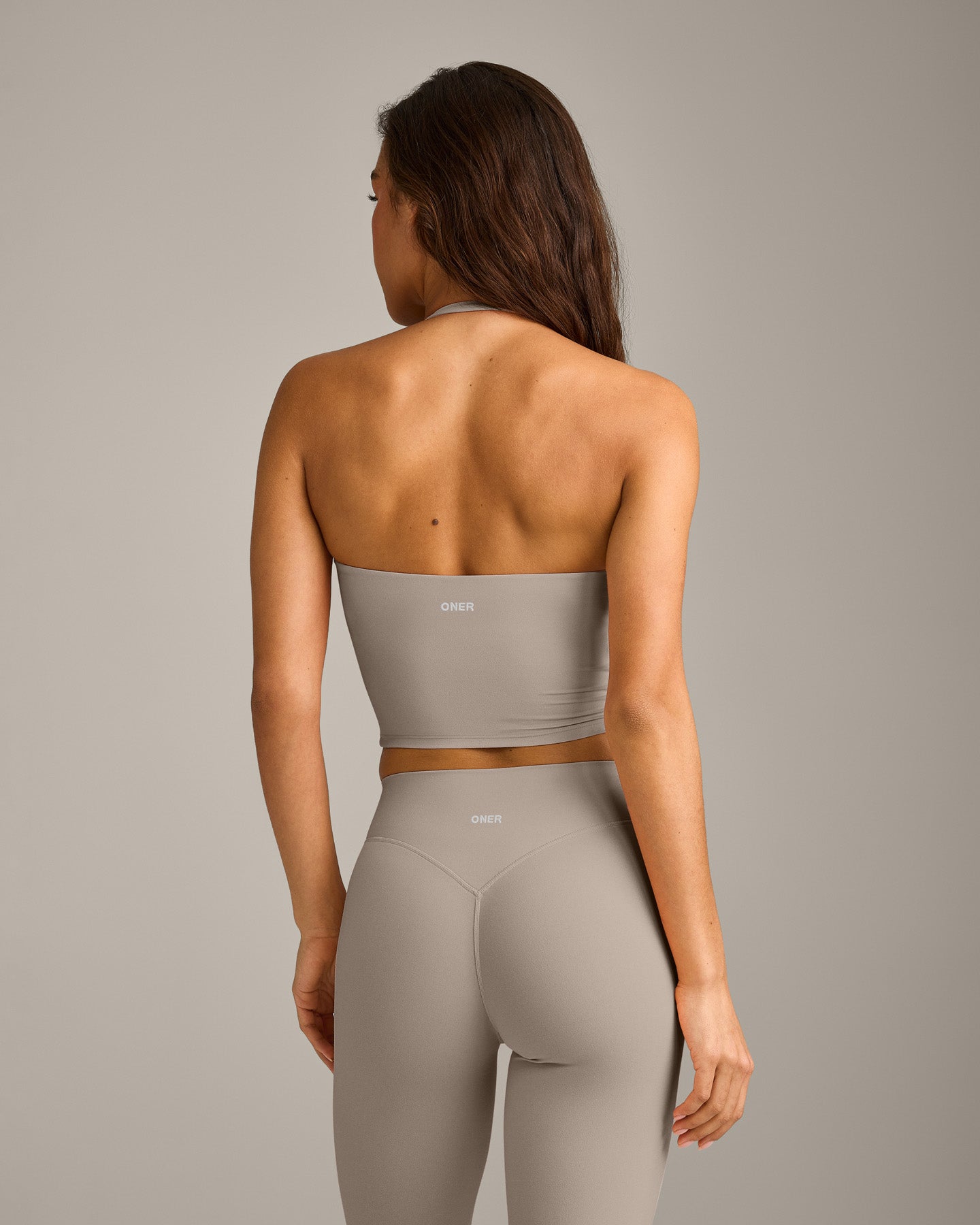 SoftMotion™ Strappy Halter Neck Mid Tank Top with Built in Bra Shelf with White Logo | Warm Sand
