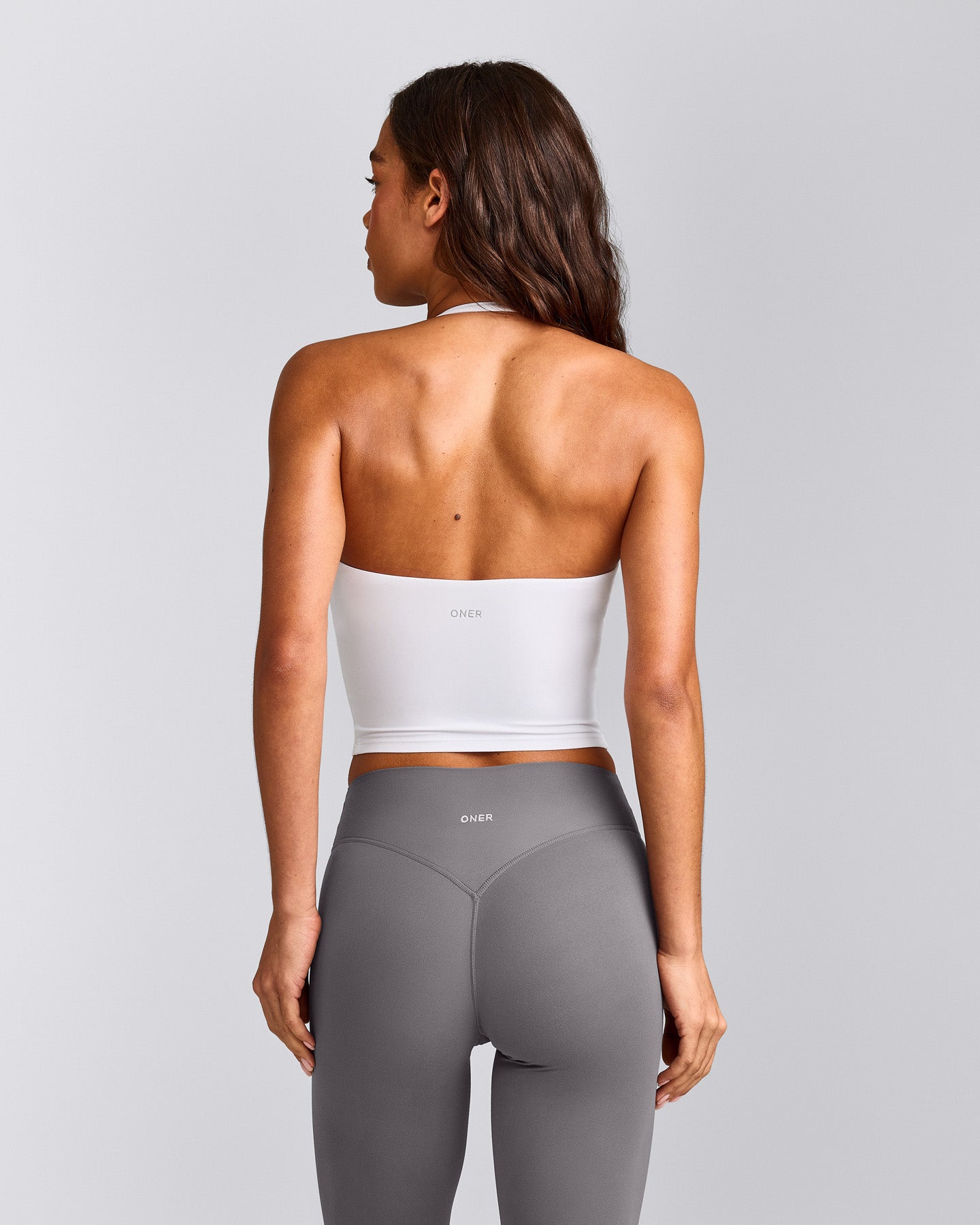 SoftMotion™ Strappy Halter Neck Mid Tank Top with Built in Bra Shelf with Gray Logo | White