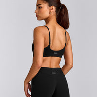 SoftMotion™ Strappy Sports Bra with Gray Logo | Black