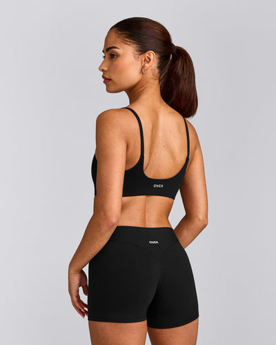 SoftMotion™ Strappy Sports Bra with Gray Logo | Black
