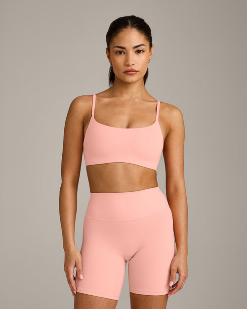 SoftMotion™ Strappy Sports Bra with Gray Logo | Peach Orange