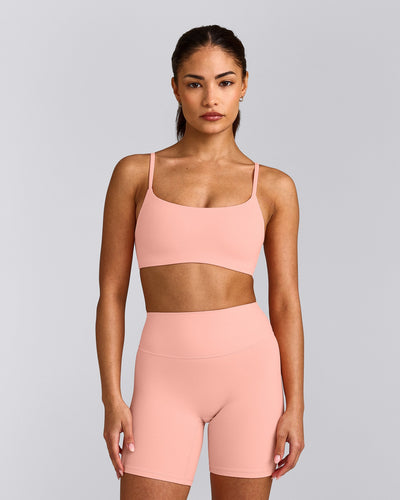 SoftMotion™ Strappy Sports Bra with Gray Logo | Peach Orange