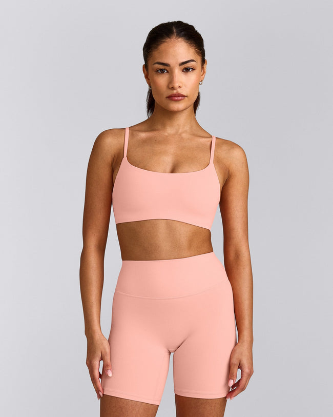 SoftMotion™ Strappy Sports Bra with Gray Logo | Peach Orange