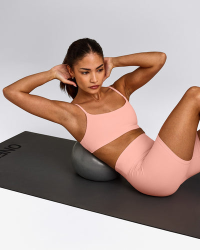 SoftMotion™ Strappy Sports Bra with Gray Logo | Peach Orange