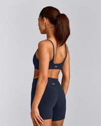 SoftMotion™ Strappy Sports Bra with Gray Logo | True Blue