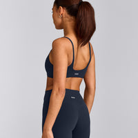 SoftMotion™ Strappy Sports Bra with Gray Logo | True Blue