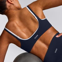 SoftMotion™ Strappy Sports Bra with Gray Logo | True Blue