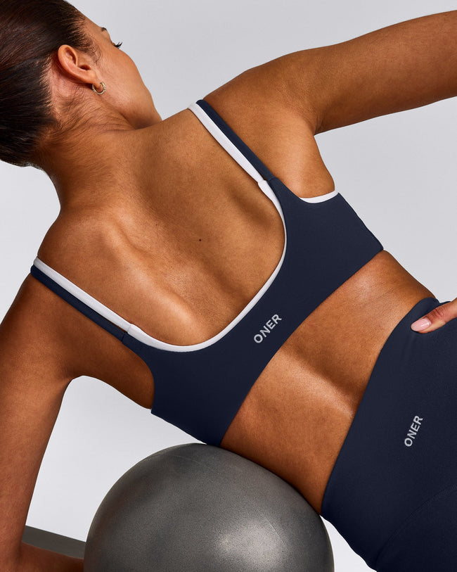 SoftMotion™ Strappy Sports Bra with Gray Logo | True Blue