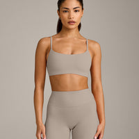 SoftMotion™ Strappy Sports Bra with White Logo | Warm Sand