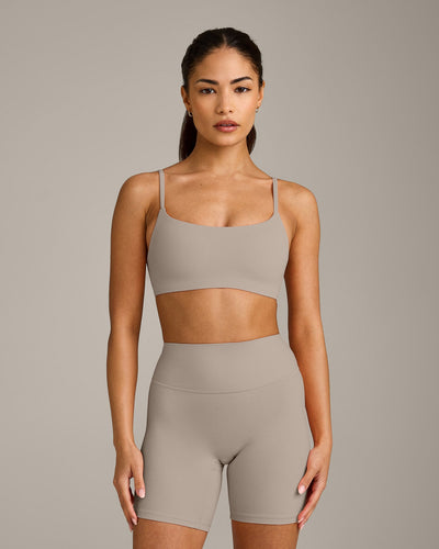 SoftMotion™ Strappy Sports Bra with White Logo | Warm Sand