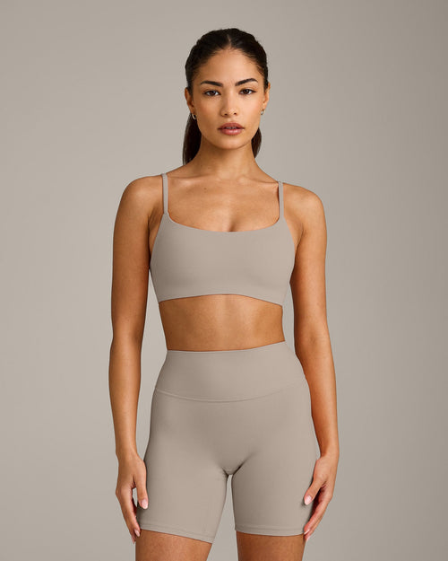 SoftMotion™ Strappy Sports Bra with White Logo | Warm Sand