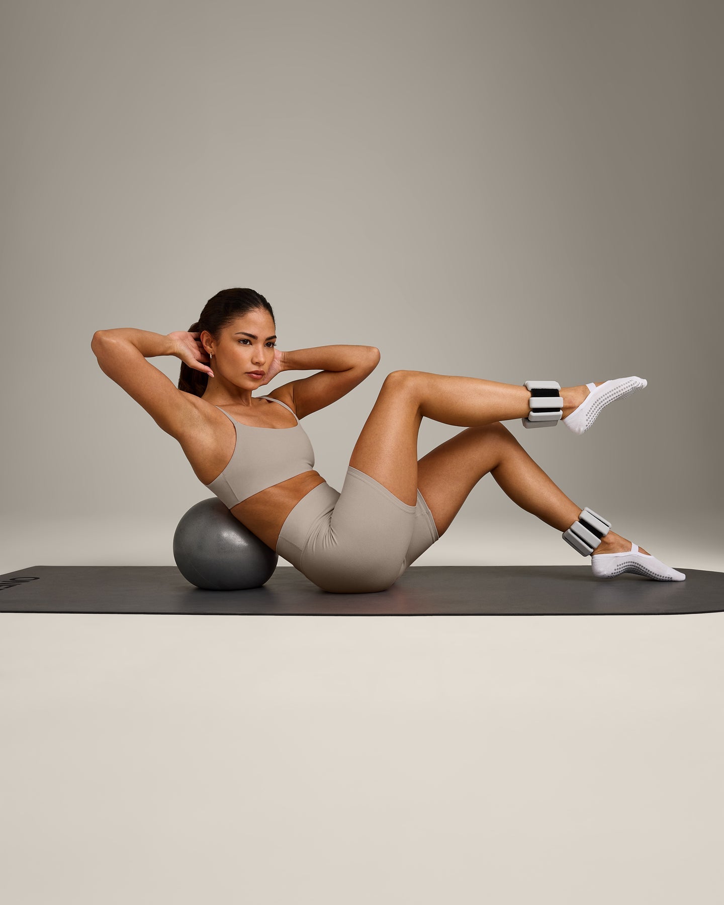 SoftMotion™ Strappy Sports Bra with White Logo | Warm Sand