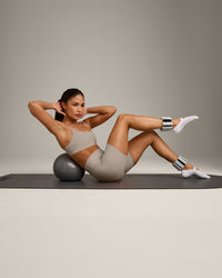 SoftMotion™ Strappy Sports Bra with White Logo | Warm Sand
