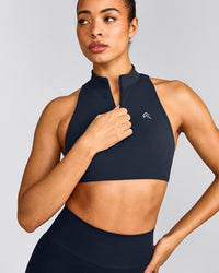 EasyLift™ Zip High Neck Sports Bra with Gray Logo | True Blue