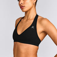 EffortlessLift™ Seamless Halter Neck Sports Bra with Gray Logo | Black
