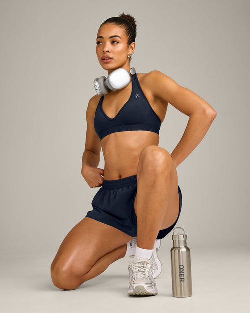 EffortlessLift™ Seamless Halter Neck Sports Bra with Gray Logo | True Blue