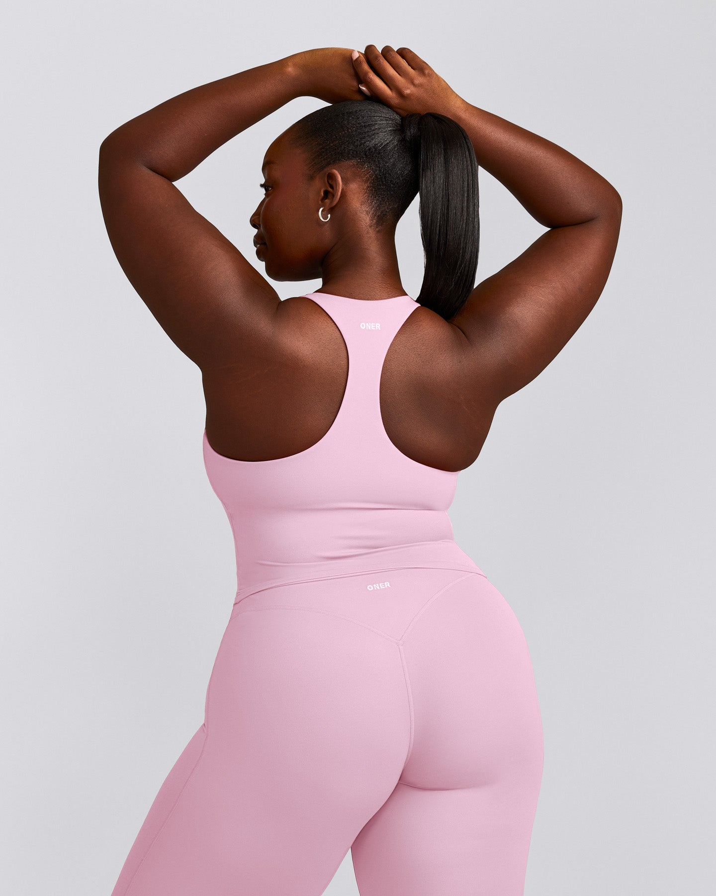SoftMotion™ Racer Back Mid Tank Top with Built in Bra Shelf with Gray Logo | Chalk Pink