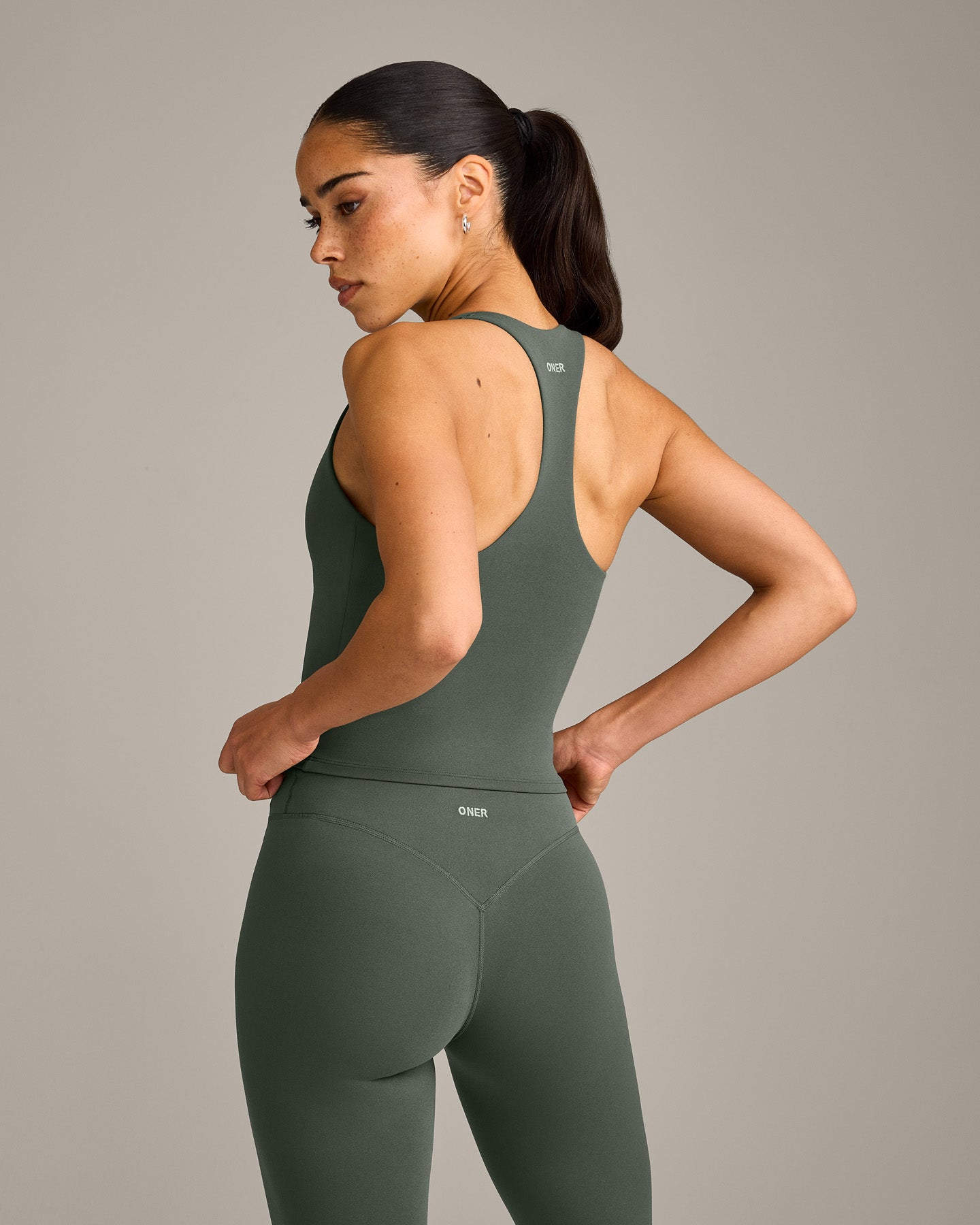 SoftMotion™ Racer Back Mid Vest with Built in Bra Shelf with Gray Logo | Dark Khaki