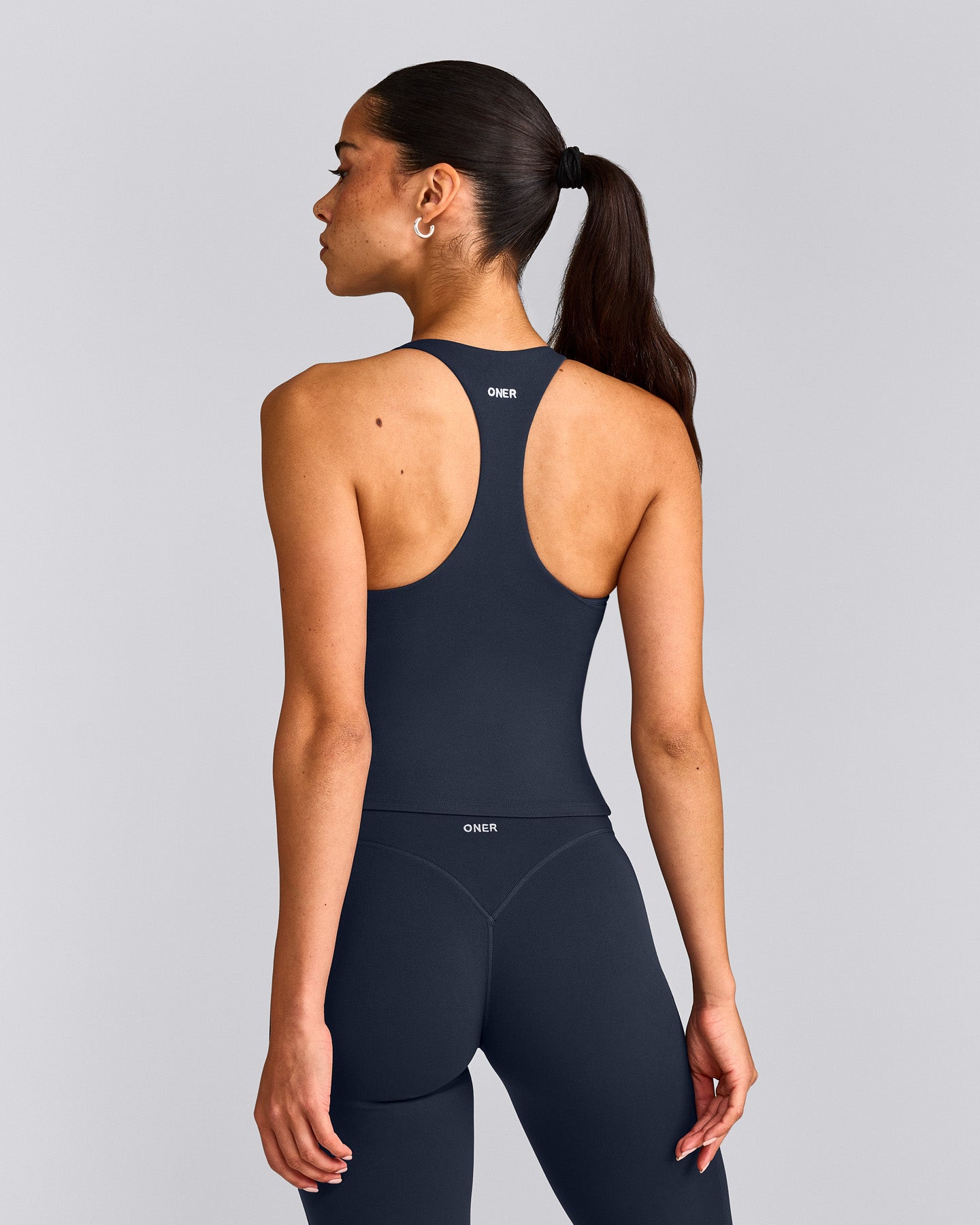 SoftMotion™ Racer Back Mid Tank Top with Built in Bra Shelf with Gray Logo | True Blue