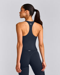 SoftMotion™ Racer Back Mid Tank Top with Built in Bra Shelf with Gray Logo | True Blue