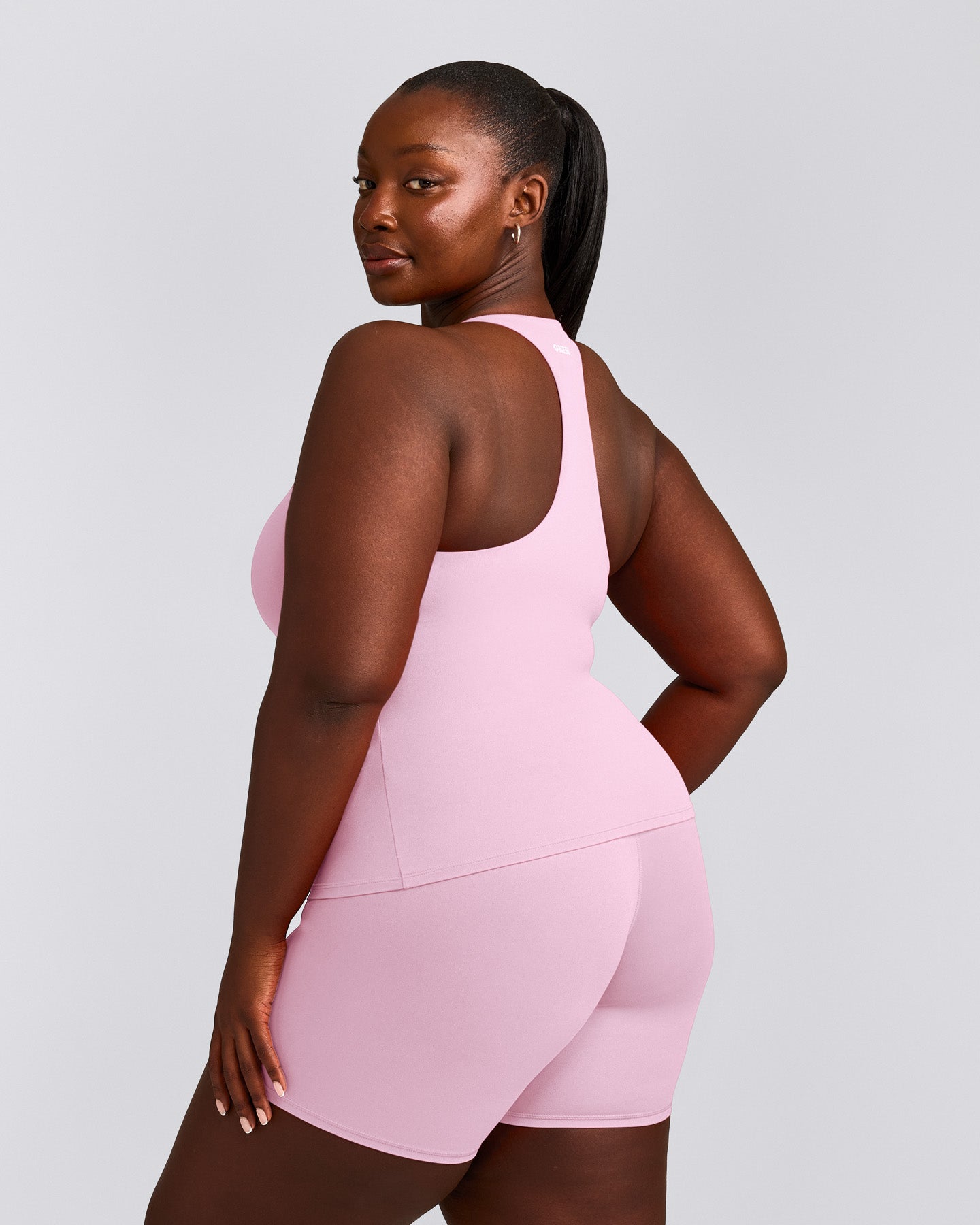 SoftMotion™ Racer Back Tank Top with Built in Bra Shelf with Gray Logo | Chalk Pink