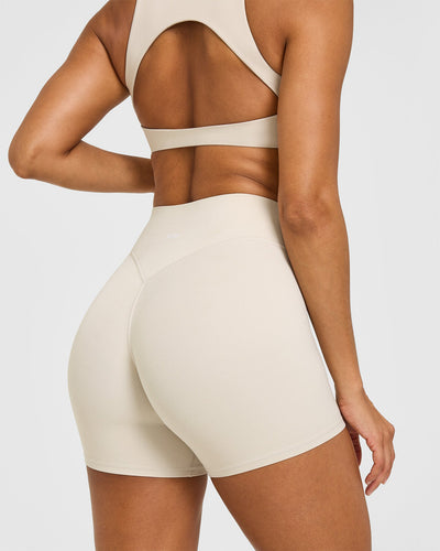 SoftMotion™ High Waisted Shorts 6" with White Logo | Sand