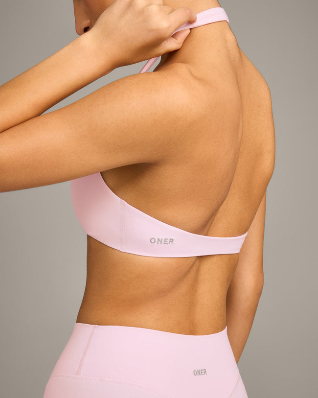SoftMotion™ Minimal Halter Neck Bralette with Gray Logo | Soft Girl Pink