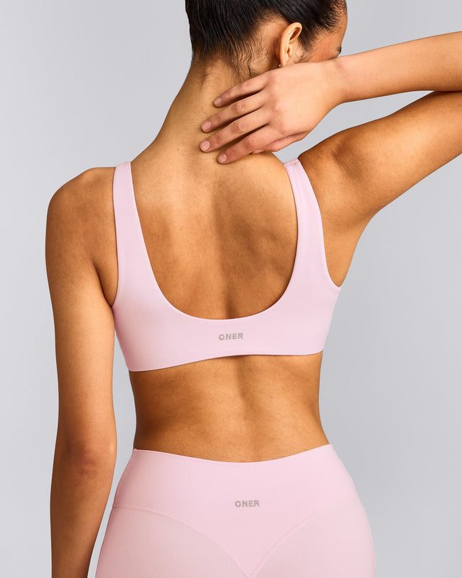 SoftMotion™ Scoop Back Bralette with Gray Logo | Soft Girl Pink