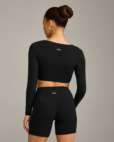 SoftMotion™ Scoop Neck Long Sleeve Crop Top with Built in Bra Shelf with Gray Logo | Black