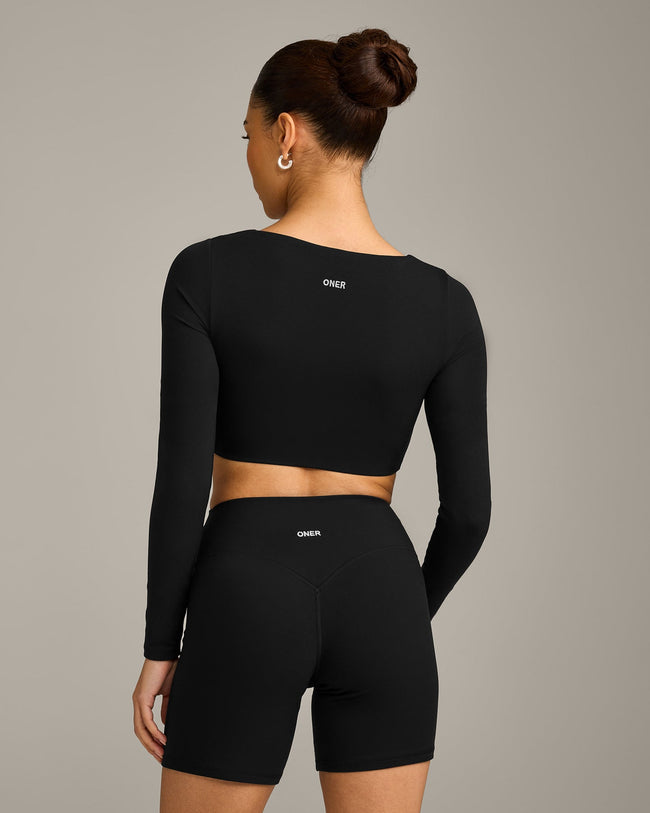 SoftMotion™ Scoop Neck Long Sleeve Crop Top with Built in Bra Shelf with Gray Logo | Black