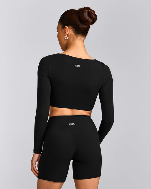 SoftMotion™ Scoop Neck Long Sleeve Crop Top with Built in Bra Shelf with Gray Logo | Black